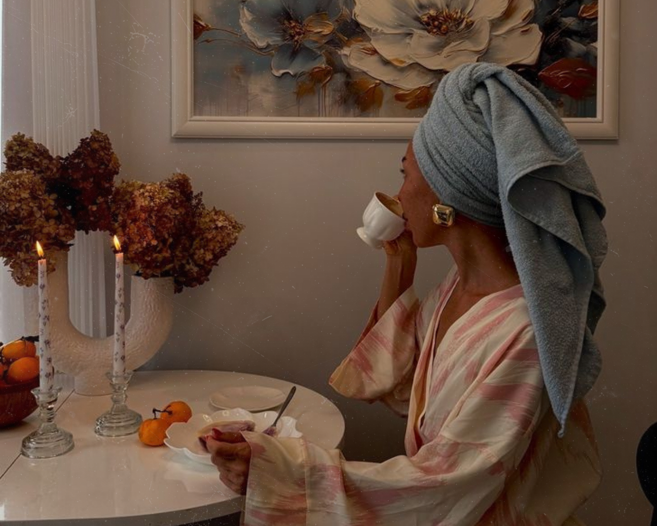 lack woman in morning self-care routine applying Arm's Reach Black IV luxury perfume at her vanity