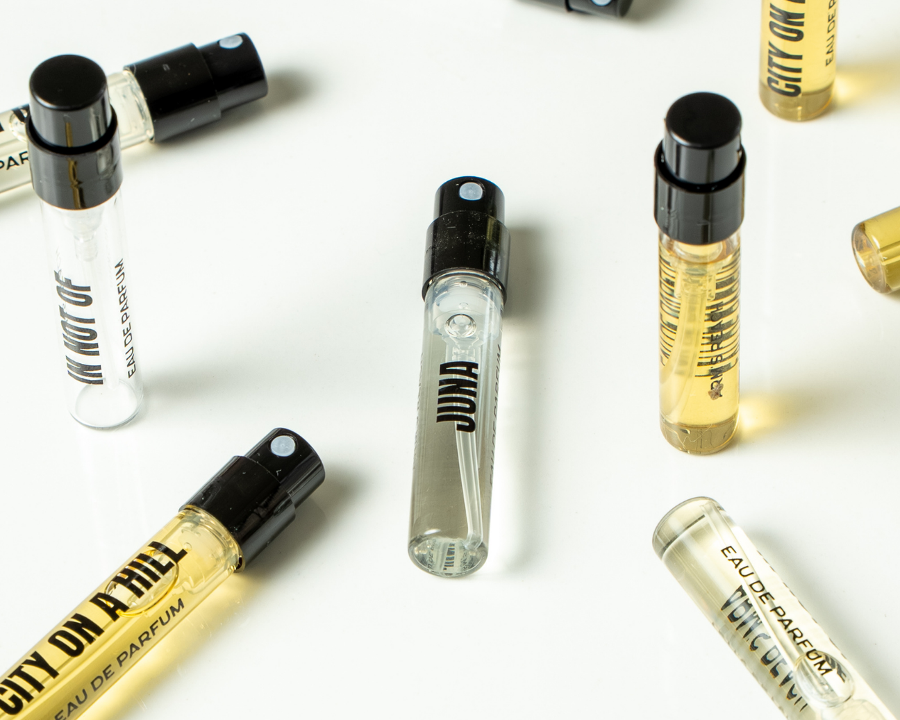 Black IV perfume bottles by Arm's Reach, a Black-owned niche fragrance brand, displayed on a neutral surface