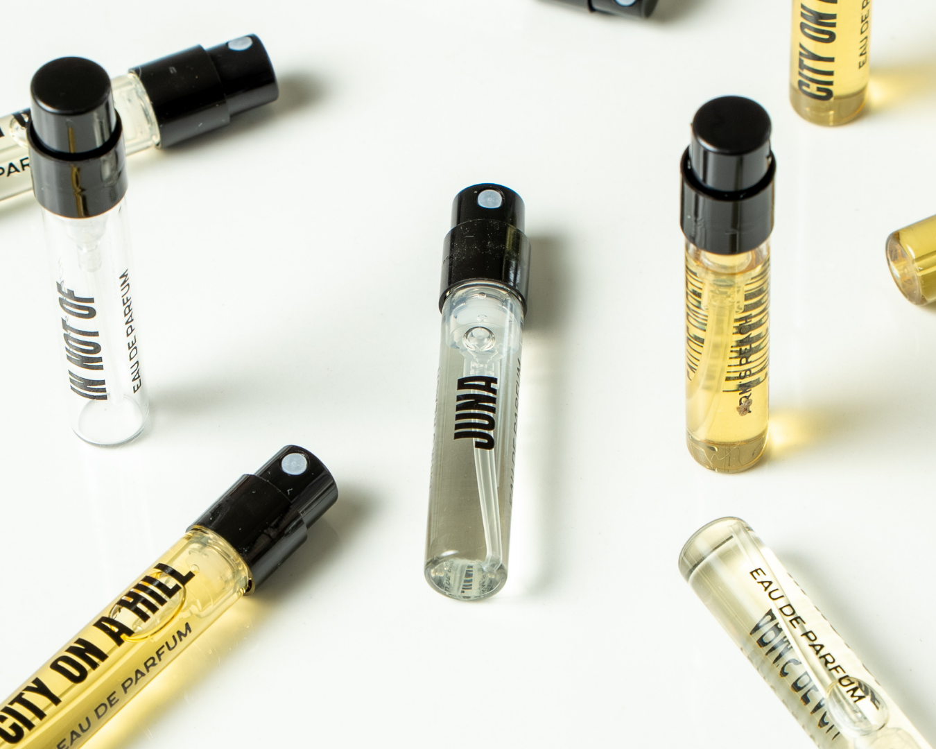 Black IV perfume bottles by Arm's Reach, a Black-owned niche fragrance brand, displayed on a neutral surface