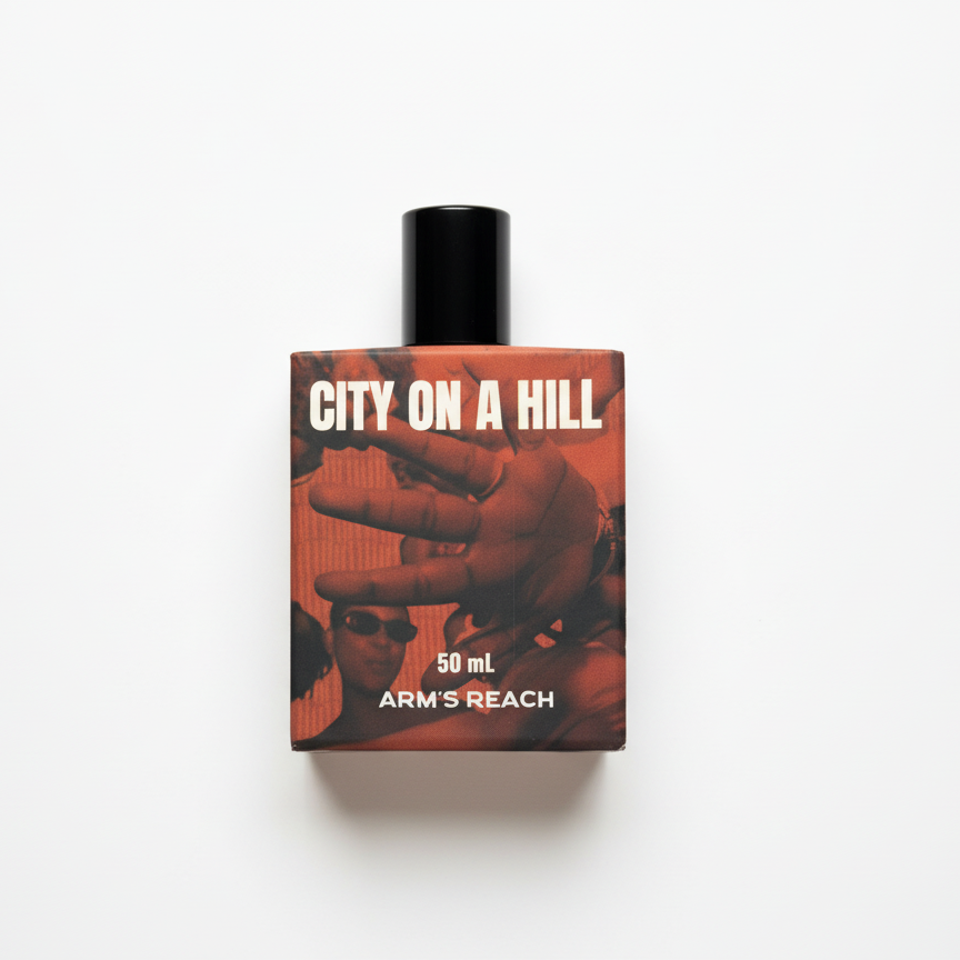City on a Hill perfume bottle by Arm's Reach, a Black-owned luxury fragrance brand, citrus resinous floral scent