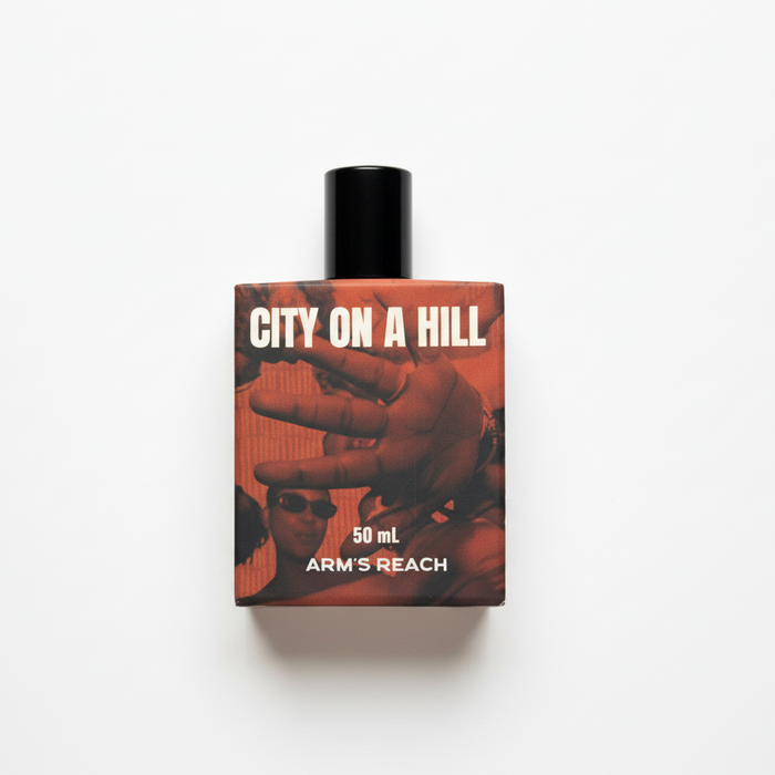 City on a Hill perfume bottle by Arm's Reach, a Black-owned luxury fragrance brand, citrus resinous floral scent