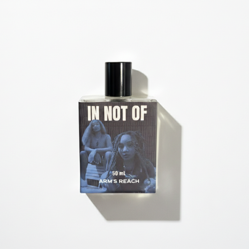 In Not Of perfume bottle by Arm's Reach, a Black-owned niche fragrance brand, savory fruity floral scent
