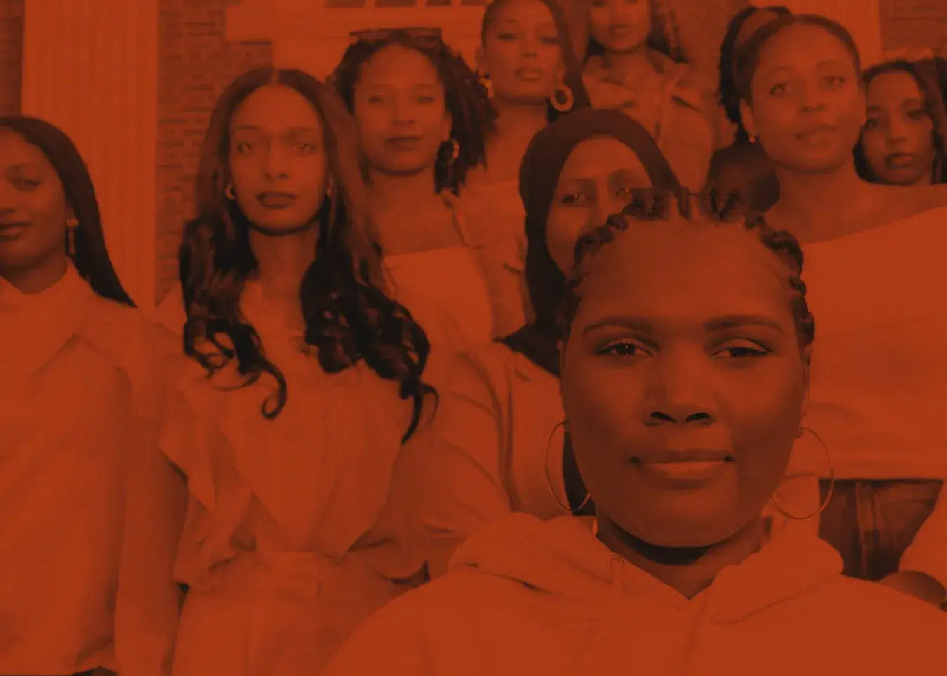 Group of Black women gathered together representing the community behind Arm's Reach, a Black-owned prestige fragrance house